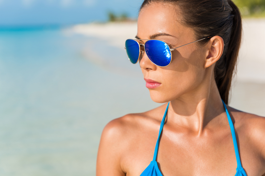 woman at the beach wearing polarized lenses