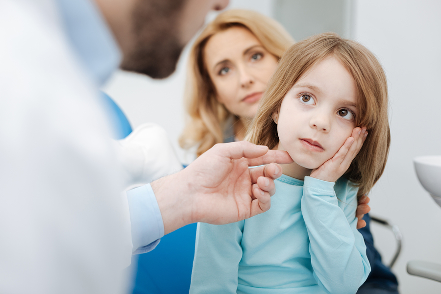 doctor explaining children’s eye safety 