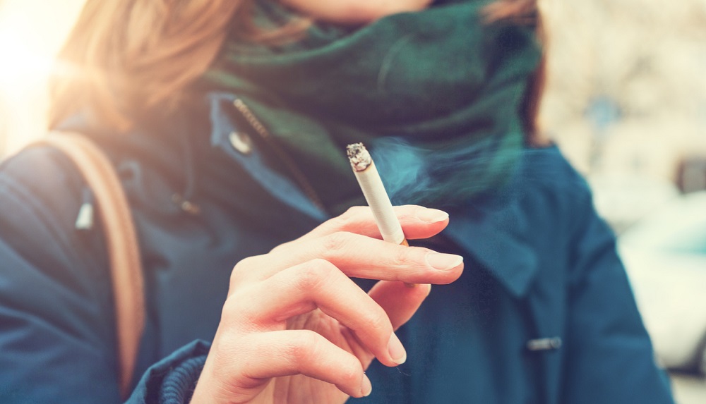 Young woman enjoying a cigarette