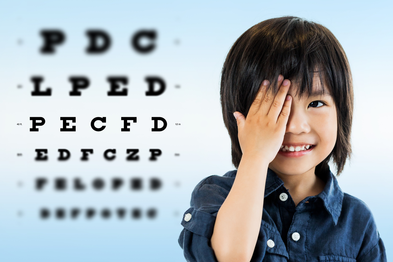 Little boy smiling during children's eye exam