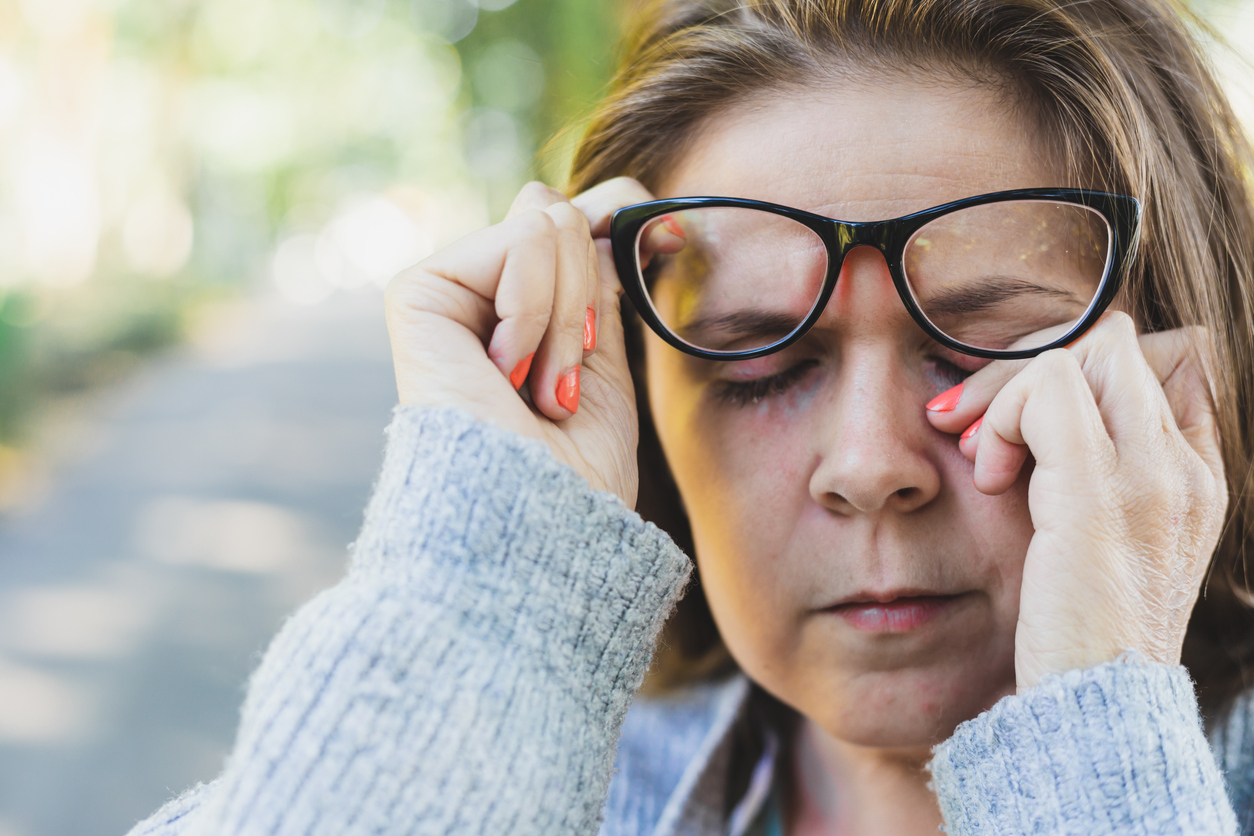 Woman's eyes burning outside