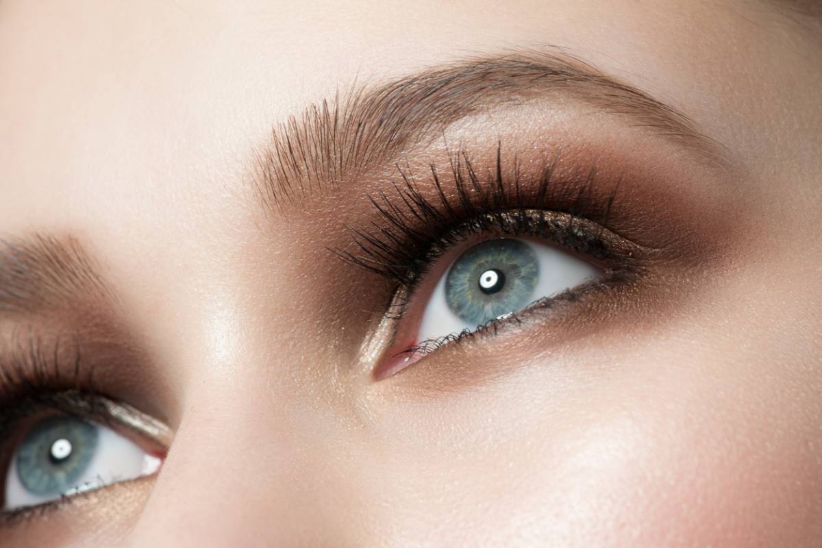 close-up image of beautiful female green grey eyes