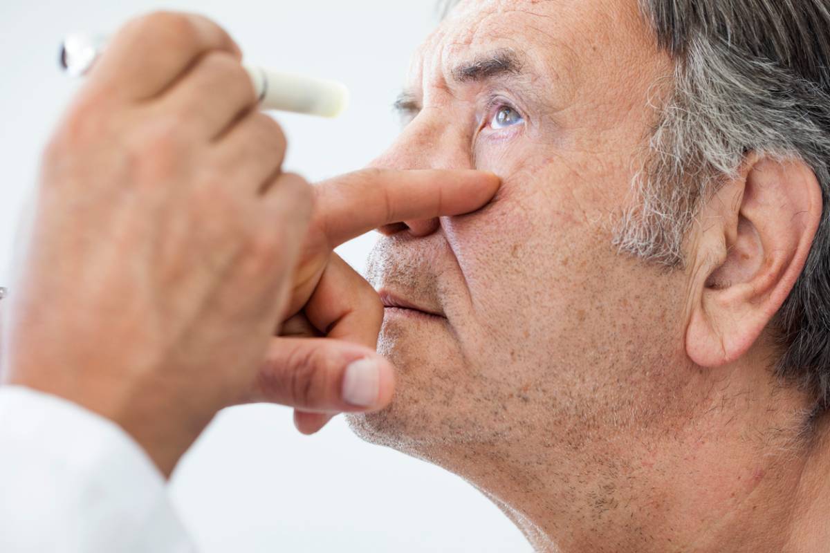 man wondering if cataracts are painful during eye exam