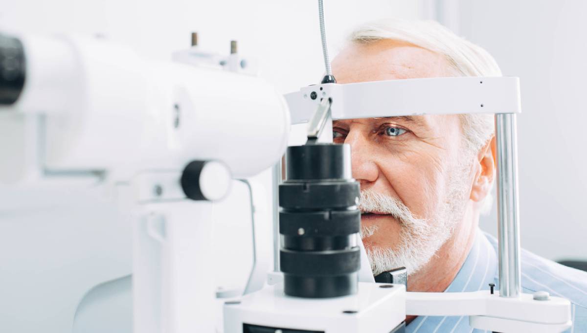 Elderly man getting exam before lasik after 60 years of age