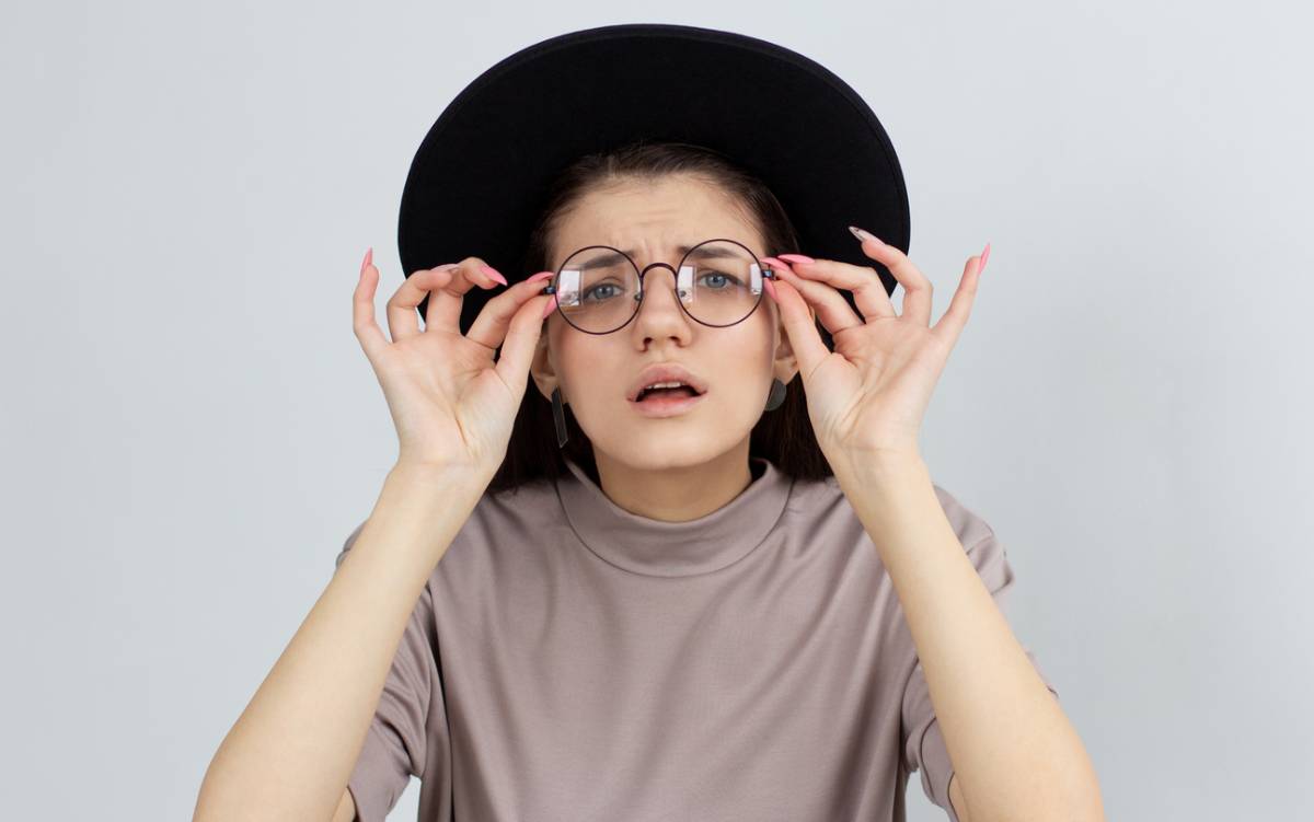 woman checking her poor eyesight